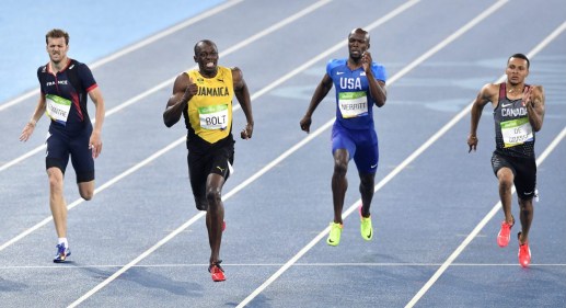 Usain Bolt, second left, wins the gold medal in the men's 200-meter final ahead of second placed Canada's Andre De Grasse, right, and third placed France's Christophe Lemaitre, left, during the athletics competitions of the 2016 Summer Olympics at the Olympic stadium in Rio de Janeiro, Brazil, Thursday, Aug. 18, 2016. (AP Photo/Martin Meissner)