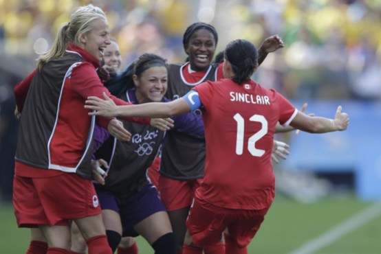 Rio 2016: Women's soccer bronze Canada's Christine Sinclair, 12, is congratulated after scoring her side's 2nd goal during the bronze medal match of the women's Olympic football tournament between Brazil and Canada at the Arena Corinthians stadium in Sao Paulo, Friday Aug. 19, 2016. (AP Photo/Nelson Antoine)