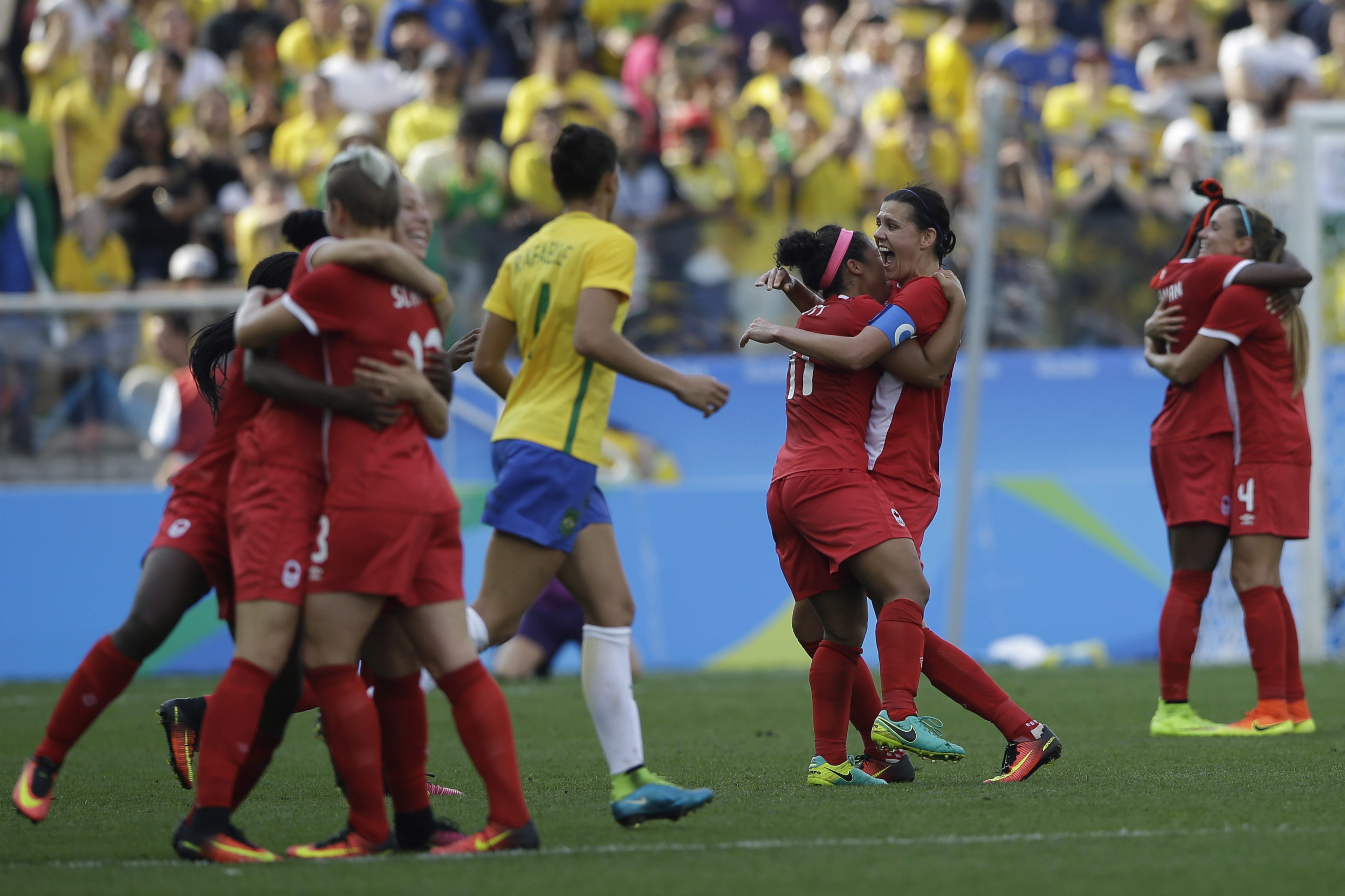 Canada players celebrate after beating Brazil 2-1 on the bronze medal match of the women's Olympic football tournament between Brazil and Canada at the Arena Corinthians stadium in Sao Paulo, Friday Aug. 19, 2016. (AP Photo/Nelson Antoine)