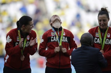 Canada players celebrates after winning the bronze medal in the women's Olympic football tournament at the Arena Corinthians stadium in Sao Paulo, Friday Aug. 19, 2016. (AP Photo/Nelson Antoine)
