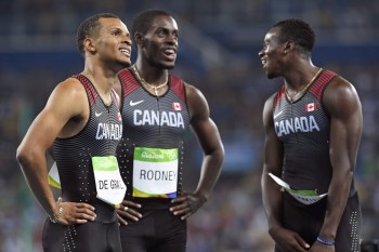 Canada's Andre De Grasse, left to right, Brendon Rodney and Aaron Brown watch the scoreboard following the men's 4x100-metre relay final at the 2016 Summer Olympics in Rio de Janeiro, Brazil on Friday, August 19, 2016. THE CANADIAN PRESS/Frank Gunn