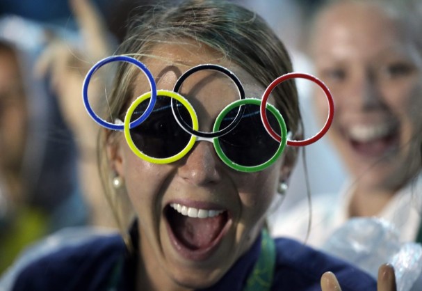 Jackie Briggs from the United States wears the Olympic ring sunglasses during the closing ceremony in the Maracana stadium at the 2016 Summer Olympics in Rio de Janeiro, Brazil, Sunday, Aug. 21, 2016. (AP Photo/David Goldman)