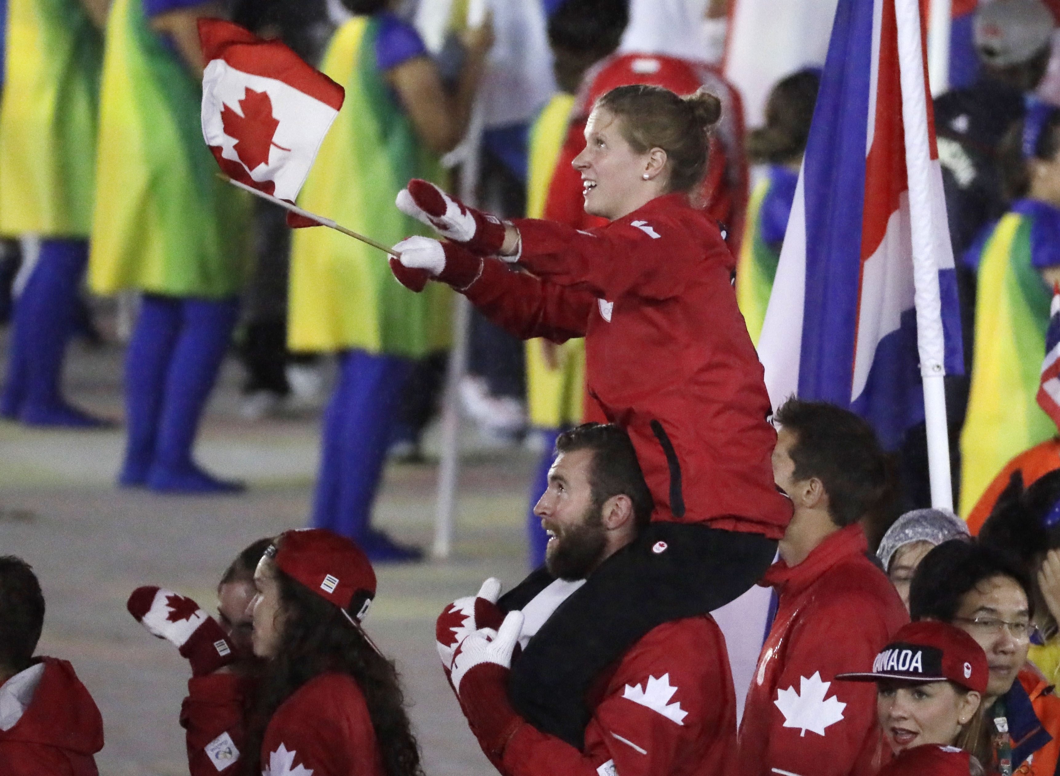 Canadian athletes celebrate during the closing ceremony in the Maracana stadium at the 2016 Summer Olympics in Rio de Janeiro, Brazil, Sunday, Aug. 21, 2016. (AP Photo/Mark Humphrey)