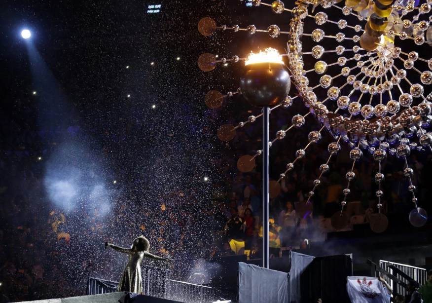 Mariene de Castro performs under the cauldron during the closing ceremony in the Maracana stadium at the 2016 Summer Olympics in Rio de Janeiro, Brazil, Sunday, Aug. 21, 2016. (AP Photo/David Goldman)