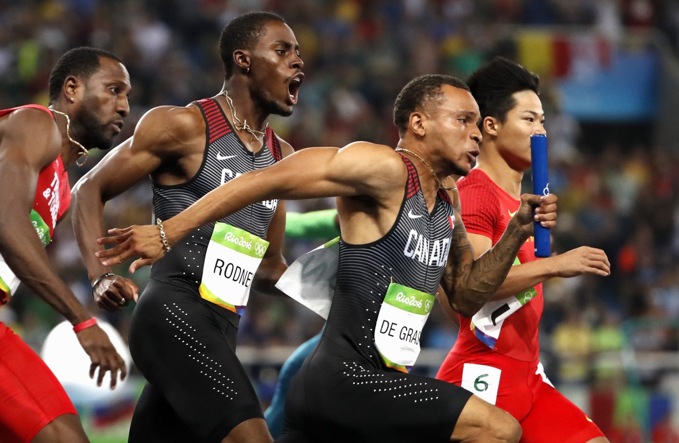 Canada's Andre De Grasse, right, and Brendon Rodney before the last part of the 4x100m relay in Rio on August 19, 2016. (photo/ Stephen Hosier)