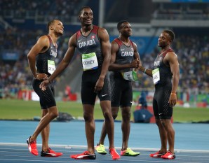 Canada's men's 4x100m relay team consisting of Andre De Grasse, Aaron Brown, Akeem Haynes and Brendon Rodney react to finishing the 4x100 relay at the Rio Olympic Games on August 19, 2016. (photo/ Mark Blinch)