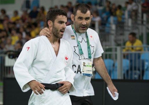 Canada's Antoine Bouchard chats with his coach after beating Imad Bassou of Morocco during Men's 66kg Judo, third-round action at the Olympic games in Rio de Janeiro, Brazil, Sunday, August 7, 2016. COC Photo by Jason Ransom