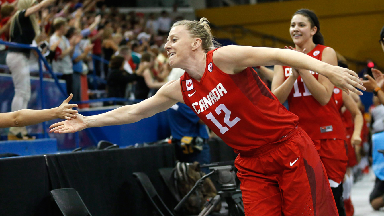 Canada's Lizanne Murphy leads the team while greeting spectators after beating the United States 81-73 in the women's basketball gold medal game at the Pan Am Games, Monday, July 20, 2015, in Toronto. (AP Photo/Julio Cortez)