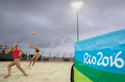 Canadian women's beach volleyball players Heather Bansley, red and Sarah Pavan, black, practice against a Brazilian team at the Olympic games in Rio de Janeiro, Brazil, Friday, July 29, 2016. COC Photo by Jason Ransom