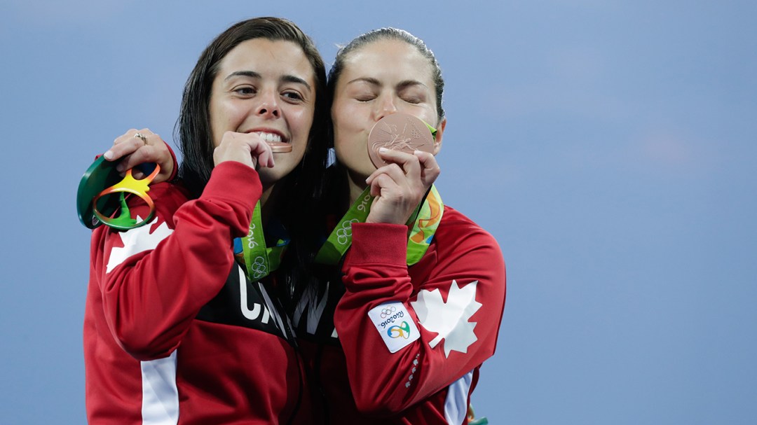 Benfeito and Filion pose with their medals after winning a bronze