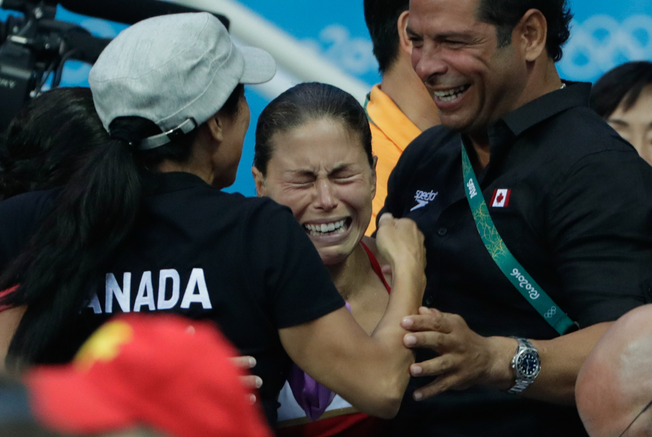 Canada's Roseline Filion reacts to the results which gave her and partner Meaghan Benfeito the bronze medal in the women's synchronized 10-meter platform diving final at the 2016 Summer Olympics in Rio de Janeiro, Brazil, Tuesday, Aug. 9, 2016 (photo/Jason Ransom)