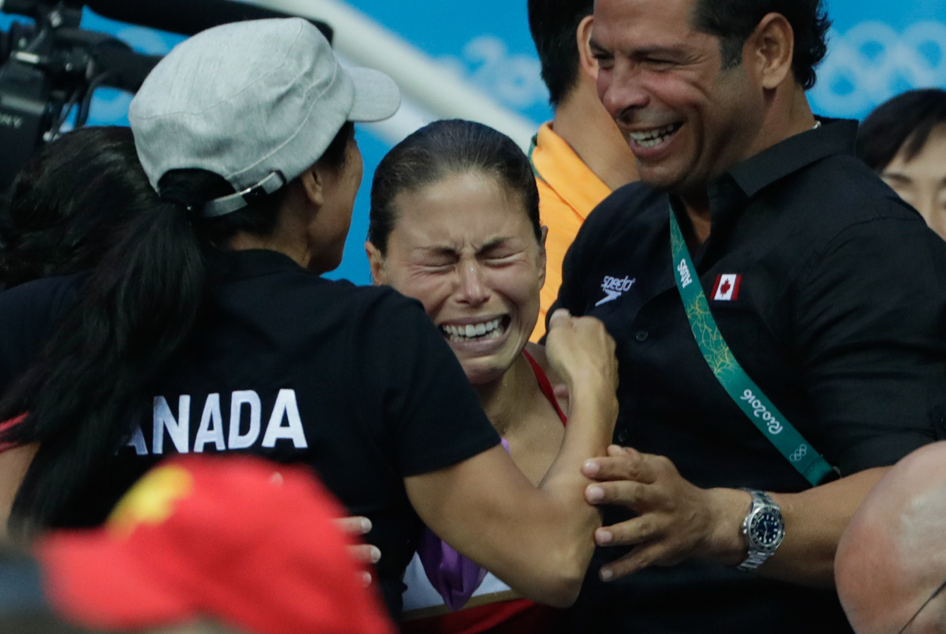 Canada's Roseline Filion reacts to the results which gave her and partner Meaghan Benfeito the bronze medal in the women's synchronized 10-meter platform diving final at the 2016 Summer Olympics in Rio de Janeiro, Brazil, Tuesday, Aug. 9, 2016 (photo/Jason Ransom)