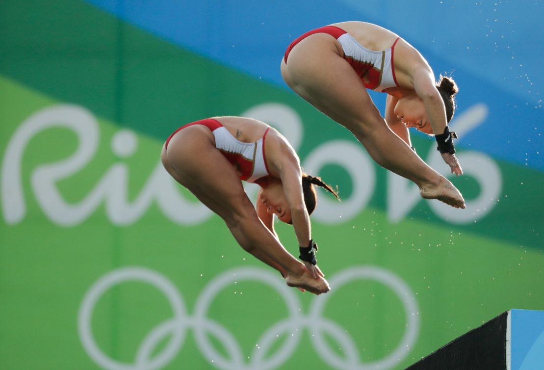 Meaghan Benfeito and Roseline Filion of Team Canada in the third round of the Women's Synchronised 10m Platform, on August 9, 2016 in Rio. COC Photo/Jason Ransom