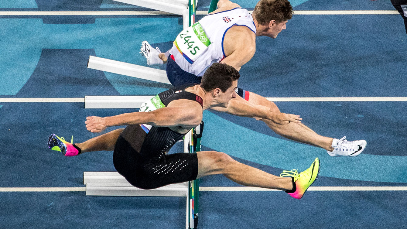 Jonathan Cabral of Canada (in dark colours) in the Olympic 110m hurdles semifinals on August 16, 2016. 