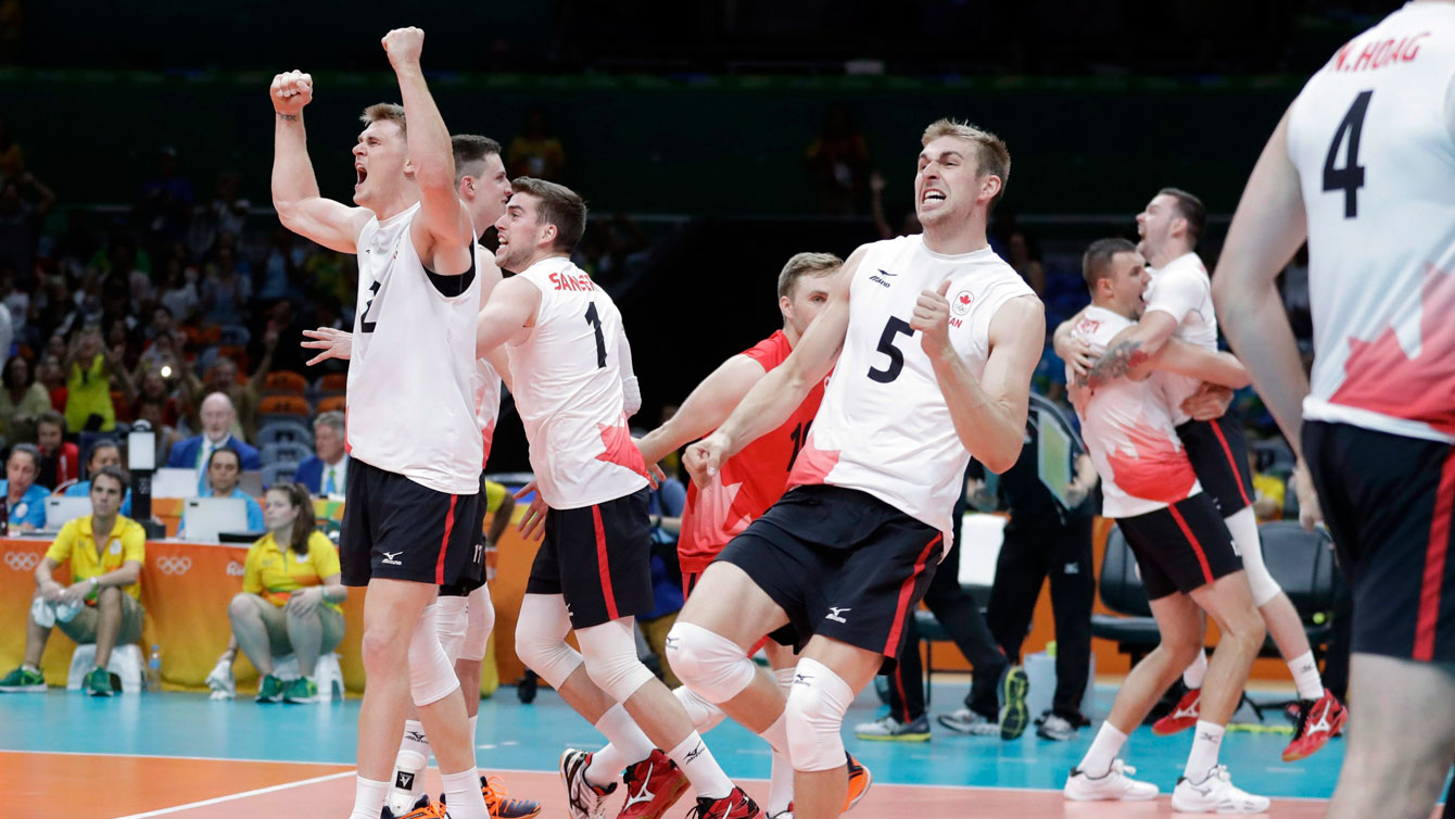 Canadian players celebrate beating the United States in Olympic volleyball in Rio de Janeiro on August 7, 2016.