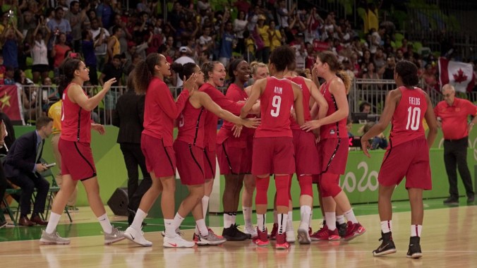Women's basketball team huddling