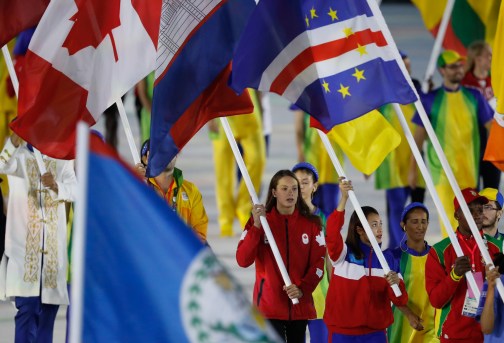 Penny Oleksiak carries the flag in the closing ceremonies during Rio 2016 on August 21, 2016. (COC/Mark Blinch)