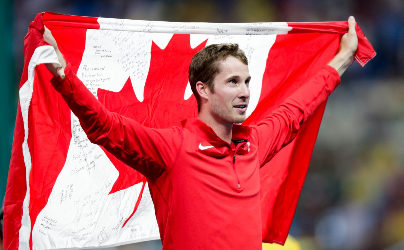 Canada's Derek Drouin celebrates after finishing first in the men's high jump final at the 2016 Summer Olympics in Rio de Janeiro, Brazil, Tuesday, August 16, 2016. (photo/Jason Ransom)