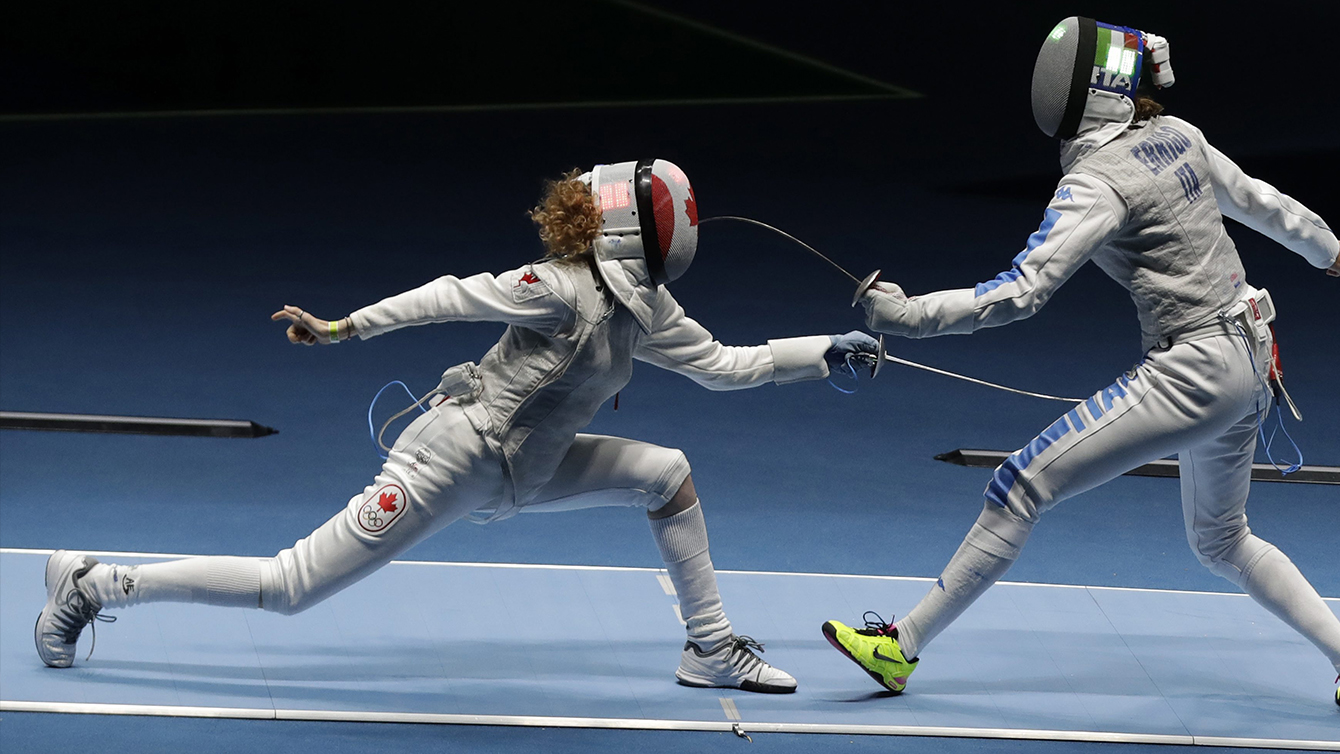 Eleanor Harvey of Canada, left, and Arianna Errigo of Italy compete in a women's individual foil event at the 2016 Summer Olympics in Rio de Janeiro, Brazil, Wednesday, Aug. 10, 2016. (AP Photo/Andrew Medichini)