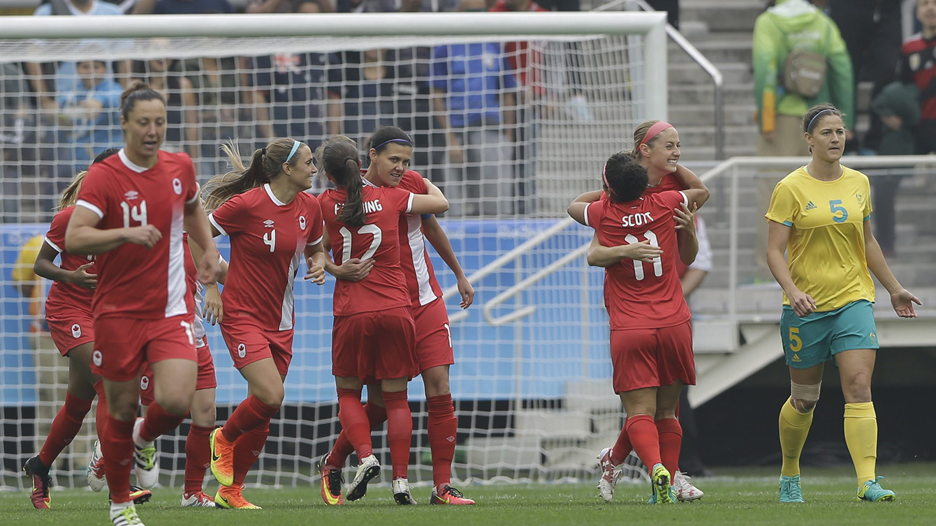 Canada players celebrate after Janine Beckie, scored her team's first goal during the 2016 Summer Olympics football match between Canada and Australia, at the Arena Corinthians, in Sao Paulo, Brazil, Wednesday, Aug. 3, 2016. (AP Photo/Nelson Antoine)
