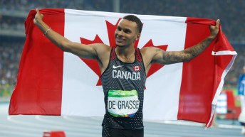 Andre de Grasse celebrating with Canadian flag