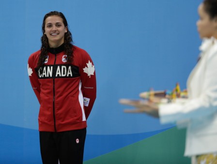 Canada's Kylie Masse being awarded her bronze medal after her 100m backstroke race on August 8, 2016 (photo/Jason Ransom)