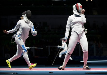 Canadian fencer Leonora Mackinnon celebrates a point against Rossella Flamingo of Italy during the Olympic games in Rio de Janeiro, Brazil, Saturday, August 6, 2016. Mackinnon lost 15-8. COC Photo by Jason Ransom