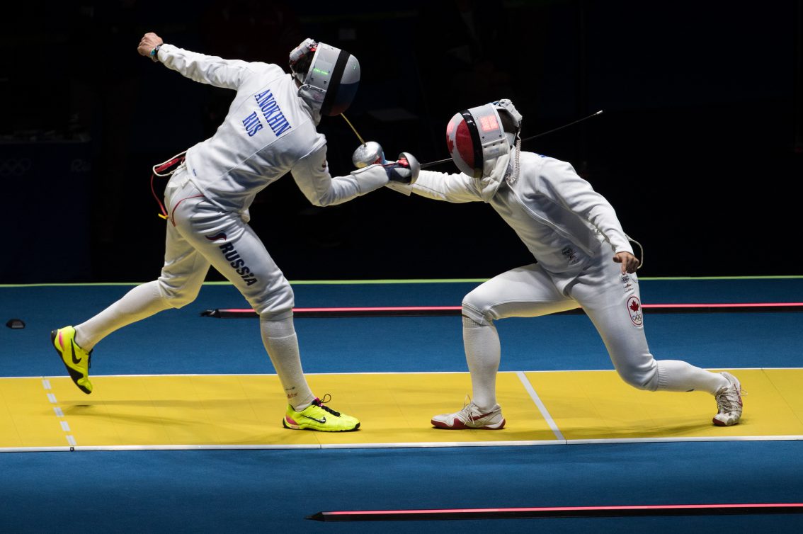 Canada's Maxime Brinck-Croteau competes against Vadim Anokhin of Russia in their Men's Epee Individual Table of 64 fencing match at the Olympic games in Rio de Janeiro, Brazil, Tuesday August 9, 2016. COC Photo/Mark Blinch