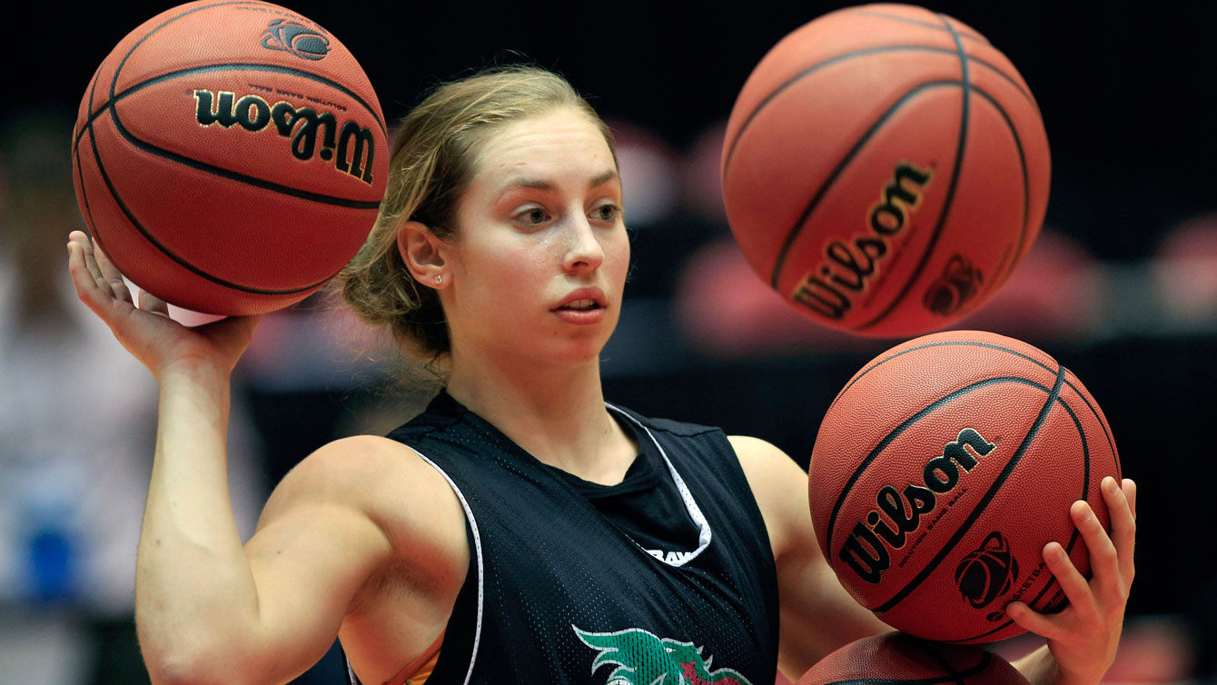 Megan Lukan passes a ball during basketball practice, Friday, March 16, 2012, in Ames, Iowa. (AP Photo/Charlie Neibergall)