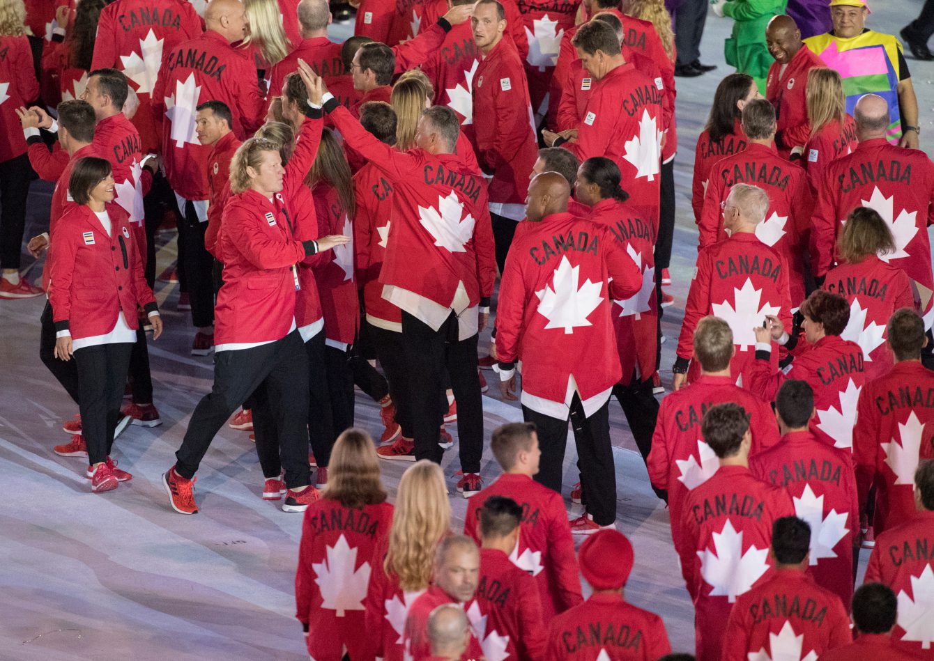 Chef de Mission Curt Harnett high-fives the team as they enter the stadium during the opening ceremonies at the Olympic games in Rio de Janeiro, Brazil, Friday, August 5, 2016. COC/Jason Ransom