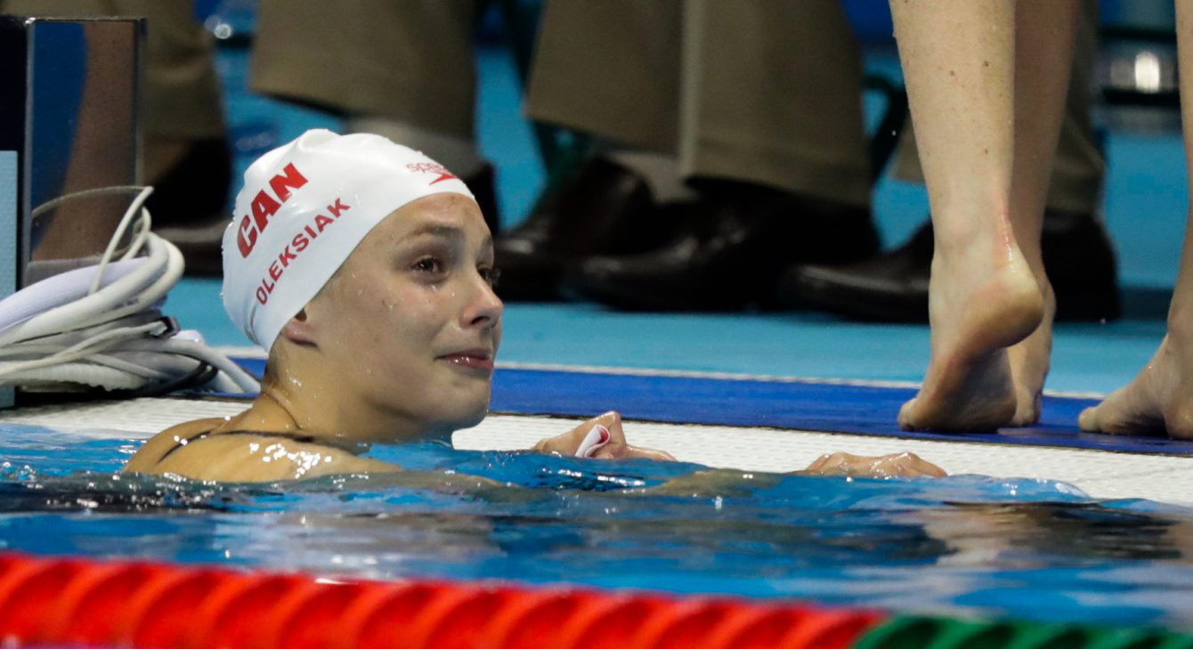 Canada's Penny Oleksiak after winning the gold medal and setting a new olympic record in the women's 100-meter freestyle during the swimming competitions at the 2016 Summer Olympics, Thursday, Aug. 11, 2016, in Rio de Janeiro, Brazil. (photo/JasonRansom)