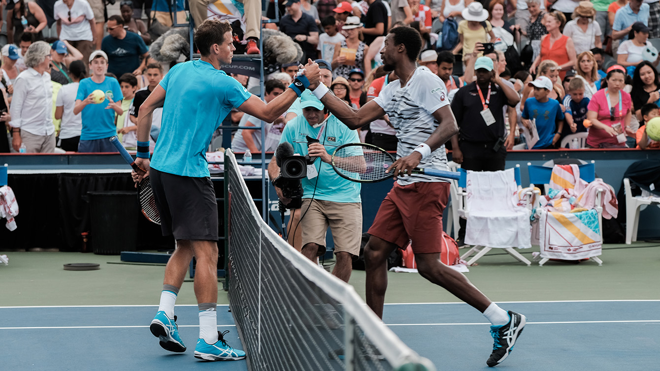 Vasek Pospisil and Gael Monfils shake hands after their match on July 26, 2016 at the Rogers Cup in Toronto. (Thomas Skrlj/COC)
