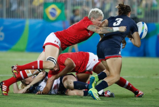 Rugby_final_MarkBlinchPhoto-89 Jen Kish attempts a tackle during the bronze medal match against Great Britain in women's rugby sevens at the 2016 Olympic Summer Games in Rio de Janeiro, Brazil on Monday, Aug. 8, 2016. (Photo/ Mark Blinch)