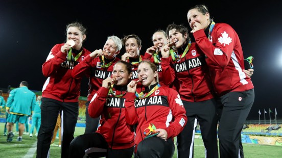 The Rio 2016 Canadian women's rugby team celebrates their bronze medal on August 8, 2016.