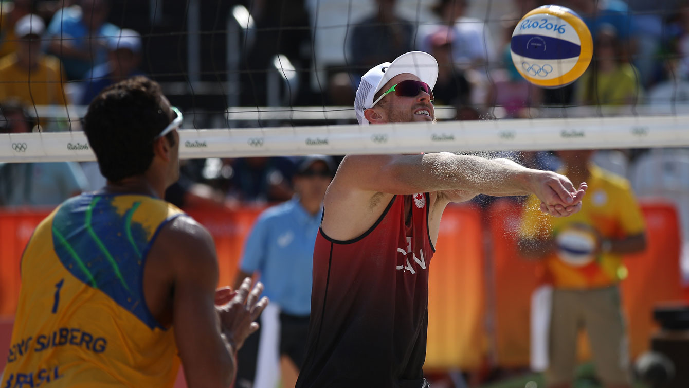 Chaim Schalk in action at Canada vs. Brazil match the Rio 2016 beach volleyball tournament, August 9, 2016 / Photo via FIVB