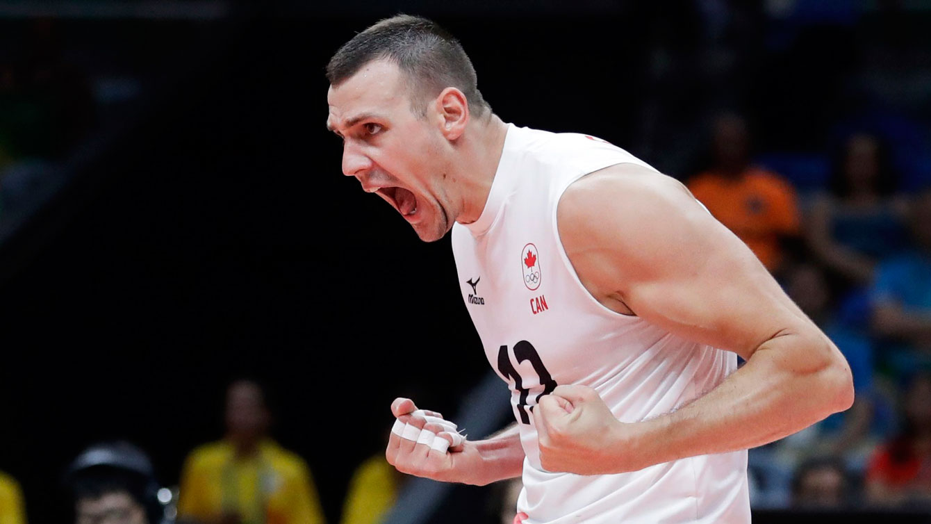 Gavin Schmitt celebrates against the United States in the Rio 2016 volleyball opener on August 7, 2016. 