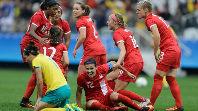 Canada's Christine Sinclair, center, celebrates with teammates after scoring her team's second goal during the 2016 Summer Olympics football match at the Arena Corinthians in Sao Paulo, Brazil, Wednesday, Aug. 3, 2016. Canada won 2-0. (AP Photo/Nelson Antoine)