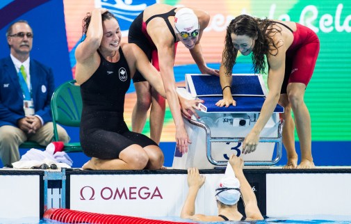 Sandrine Mainville, Chantal Van Landeghem, Taylor Ruck, and Penny Oleksiak celebrate winning bronze in the Women's swimming 4 x 100m Freestyle Relay Final qualifying at the Olympic games in Rio de Janeiro, Brazil, Saturday August 6, 2016. COC Photo/Mark Blinch
