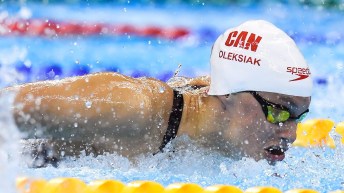 Penny Oleksiak swimming a butterfly race