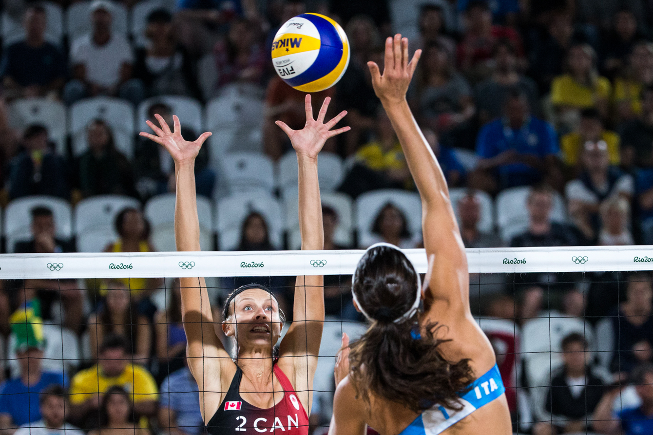 Team Canada's women's beach volleyball duo, Kristina Valjas and Jamie Broder, battle in a preliminary match against Italy, Copacabana Beach, Rio de Janeiro, Brazil, Sunday August 7, 2016. COC Photo/David Jackson