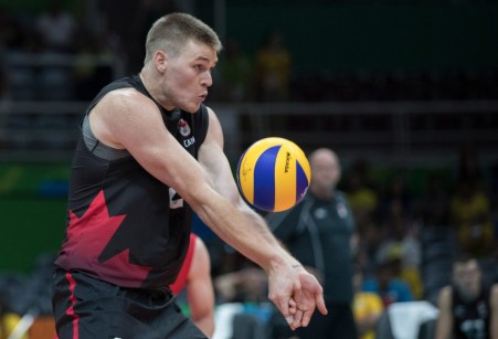 Canada's Gord Perrin bumps the ball during quarterfinal volleyball action against Russia at the Olympic games in Rio de Janeiro, Brazil, Wednesday, August 17, 2016. COC Photo by Jason Ransom