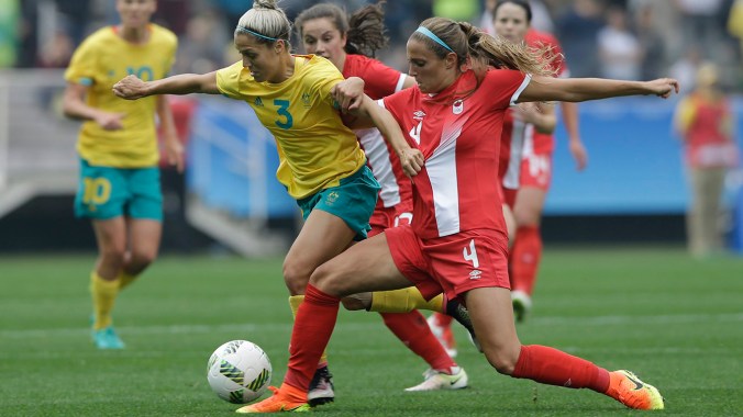 Australia's Katrina Gorry, left, fights for the ball with Canada's Shelina Zadorsky during the 2016 Summer Olympics football match at the Arena Corinthians in Sao Paulo, Brazil, Wednesday, Aug. 3, 2016. (AP Photo/Nelson Antoine)