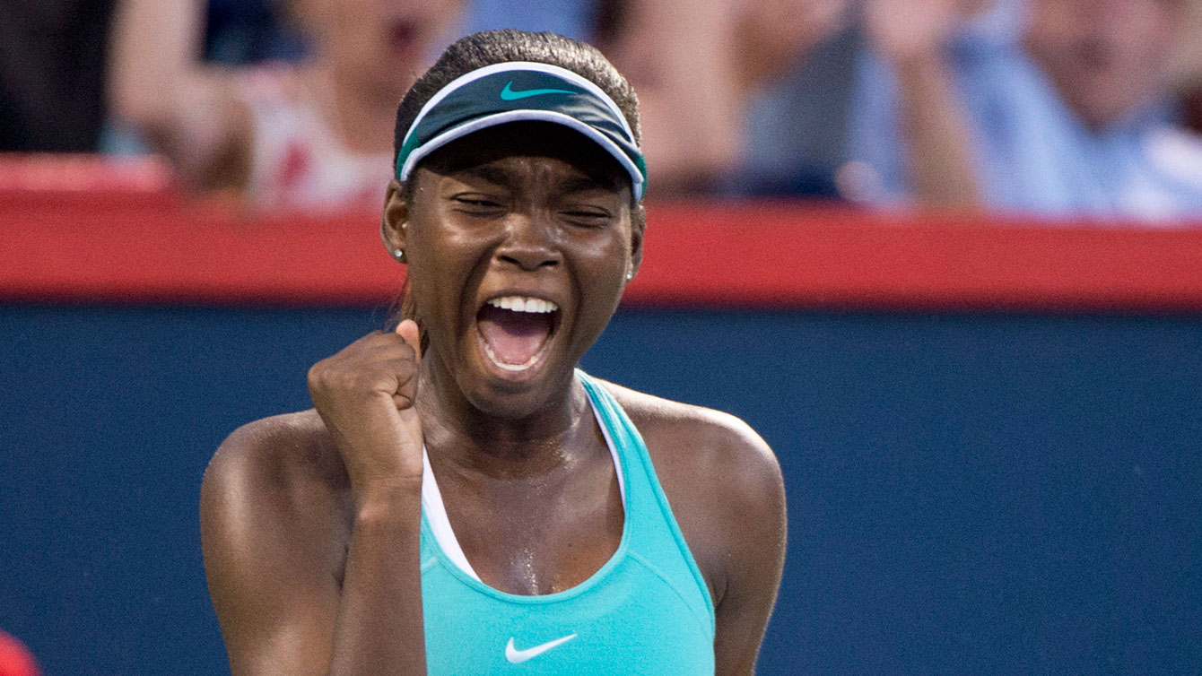 Francoise Abanda celebrates her first round victory at the 2016 Rogers Cup in Montreal. (The Canadian Press/ Paul Chiasson)