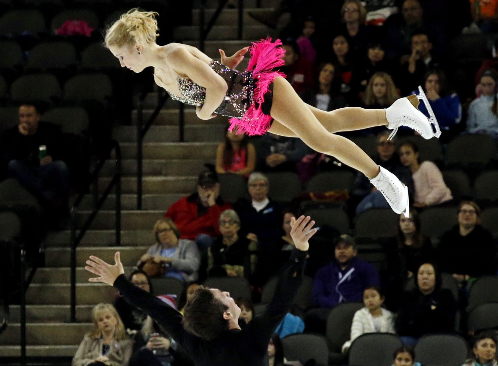 Julianne Seguin and Charlie Bilodeau of Canada compete in the pairs short program at the Skate America figure skating event, in Hoffman Estates, Ill., Friday, Oct. 21, 2016. (AP Photo/Nam Y. Huh)