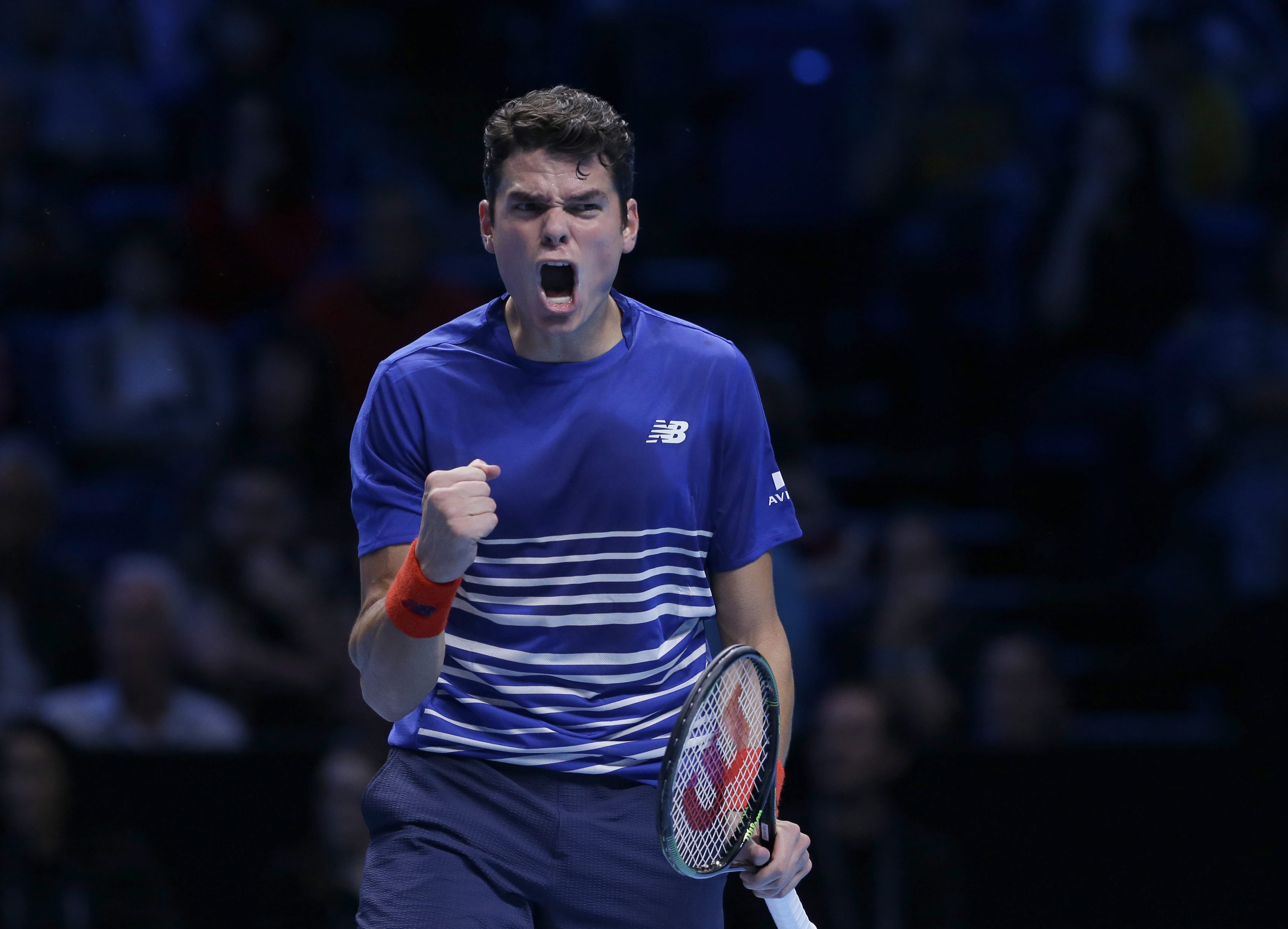 Canada's Milos Raonic reacts after winning a game against Serbia's Novak Djokovic during their ATP World Tour Finals singles tennis match at the O2 arena in London, Tuesday, Nov. 15, 2016. (AP Photo/Alastair Grant)