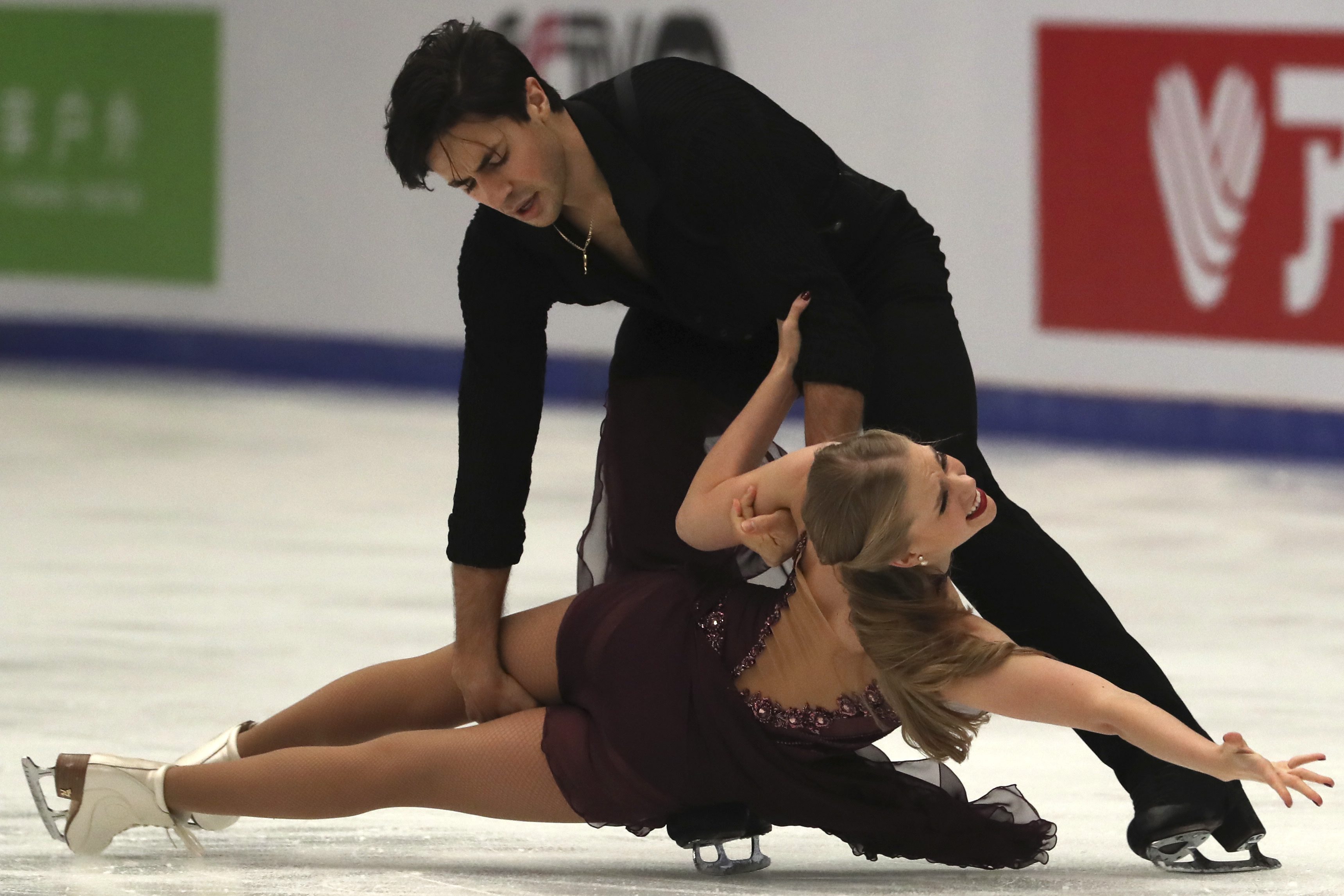 Kaitlyn Weaver and Andrew Poje of Canada compete in the Ice Dance Free Dance of the Audi Cup of China ISU Grand Prix of Figure Skating 2016 held in the Capital Gymnasium in Beijing, China, Saturday, Nov. 19, 2016. (AP Photo/Ng Han Guan)