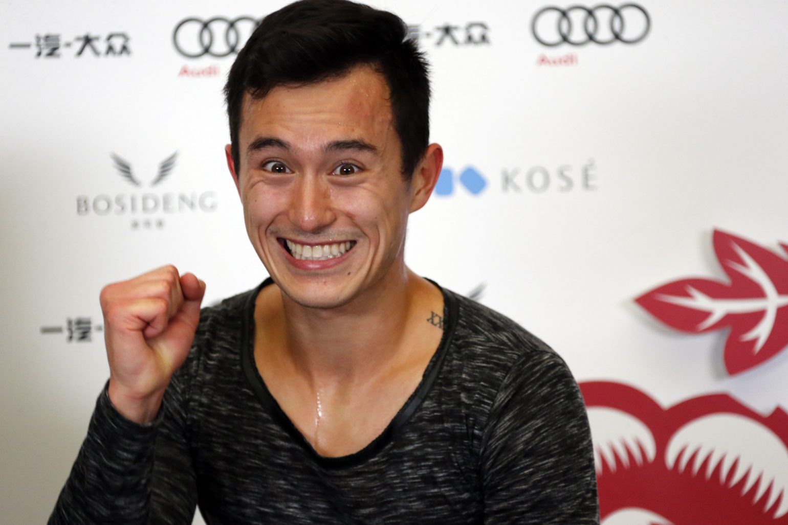 Patrick Chan of Canada celebrates after winning the overall Men event of the Audi Cup of China ISU Grand Prix of Figure Skating 2016 held in the Capital Gymnasium in Beijing, China, Saturday, Nov. 19, 2016. (AP Photo/Ng Han Guan)