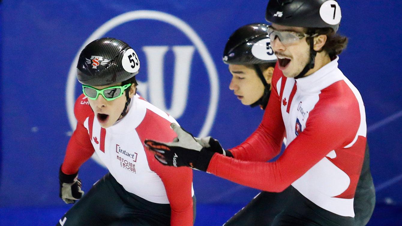 Charle Cournoyer and Samuel Girard celebrate going 1-2 in the men's 1000m at the World Cup in Calgary on Nov. 6. ( Photo: THE CANADIAN PRESS/Jeff McIntosh)