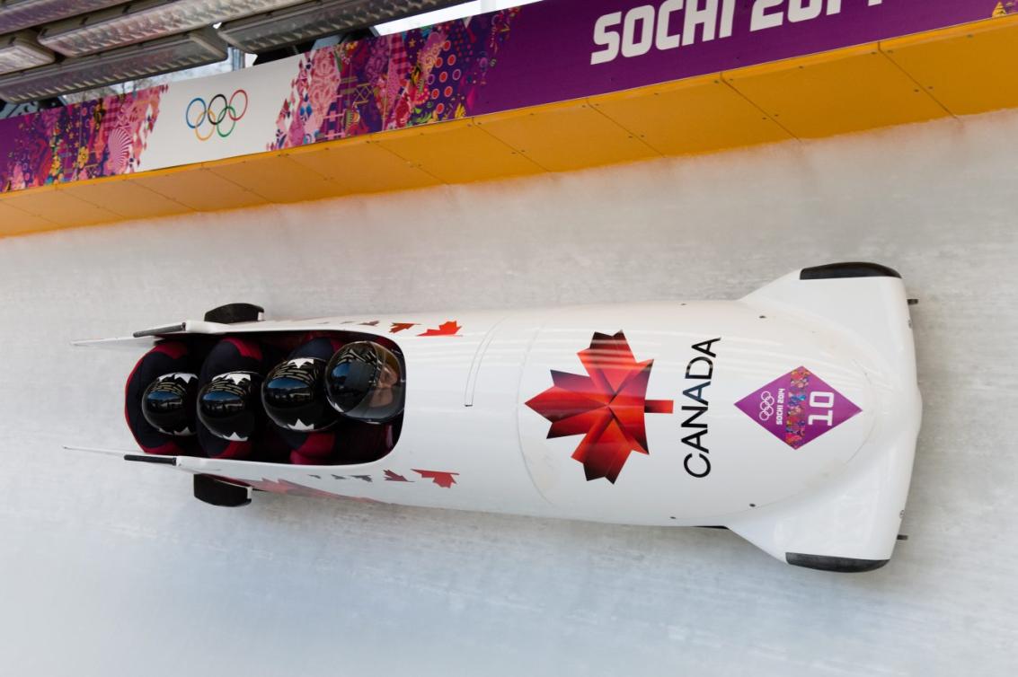 Justin Kripps pilots the Canada 1 sled at Sochi 2014. Photo by Jason Ransom.