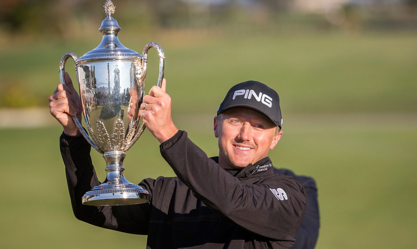 Mackenzie Hughes poses after winning the RSM Classic golf tournament on Nov. 21, 2016, in St. Simons Island, Ga. (AP Photo/Stephen B. Morton)